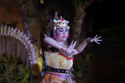 Woman in traditional clothing dancing