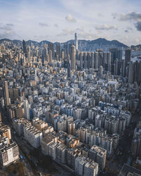 High angle view of modern buildings in city against sky