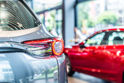 Close-up of red car in city