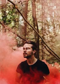 Young man in forest