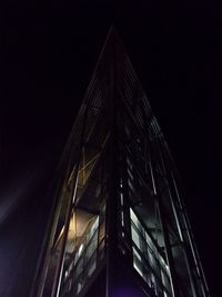 Low angle view of illuminated building at night