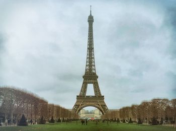 View of tower against cloudy sky