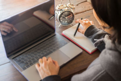 Close-up of woman working on laptop