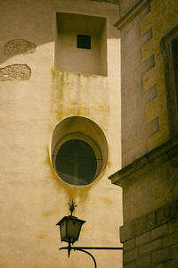 Oval window in a street of montepulciano, italy