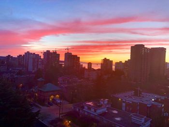 High angle view of buildings against sky during sunset