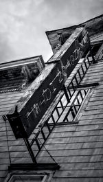 Low angle view of abandoned building against sky