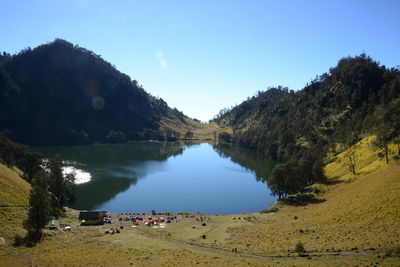 Scenic view of lake and trees against sky