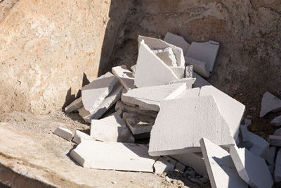 High angle view of broken stack on rock at construction site