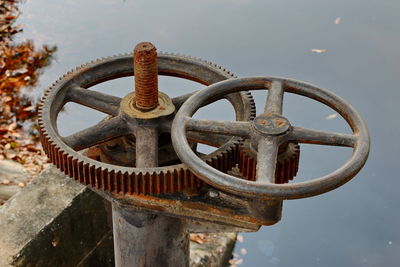 Close-up of rusty chain against sky