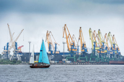 Boats moored at harbor