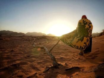 Scenic view of desert against sky during sunset