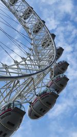 Low angle view of ferris wheel against sky