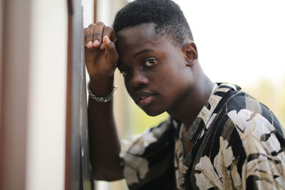 Portrait of young man standing outdoors