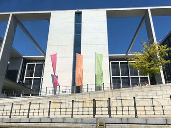 Low angle view of buildings against clear blue sky