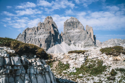 Low angle view of rock formations on landscape against sky