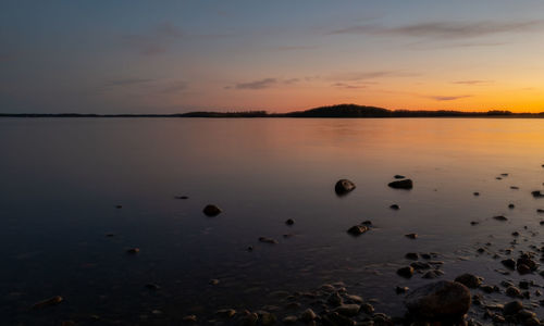 Scenic view of lake against sky during sunset