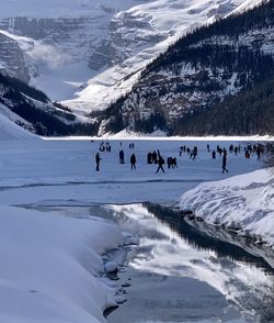 Group of people on snowcapped mountains during winter