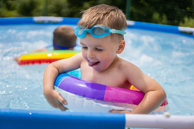 Close-up of boy swimming in pool