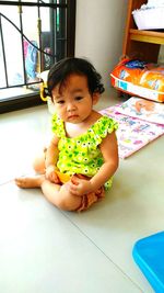 Portrait of cute girl playing at home