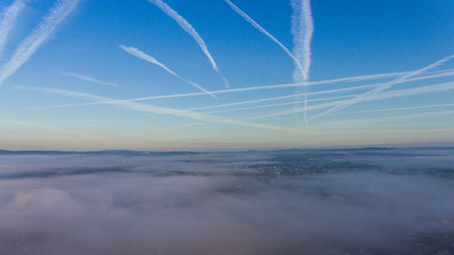 Low angle view of vapor trails in sky