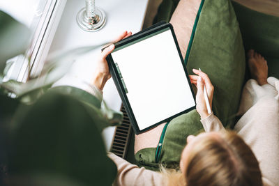 High angle view of woman using mobile phone