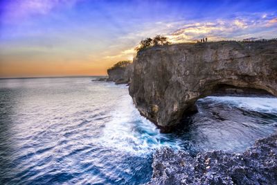 Scenic view of sea against cloudy sky