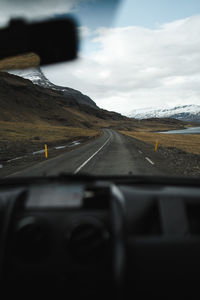 Road seen through car windshield