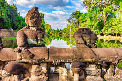 Statue of historic building against cloudy sky