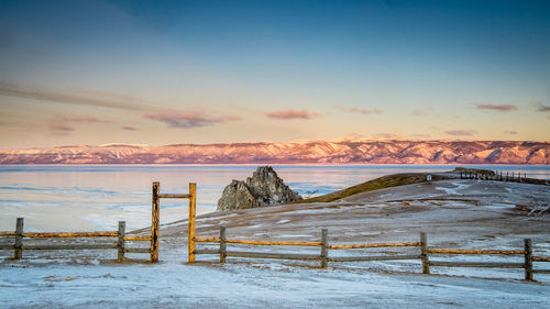 Scenic view of sea against sky during winter