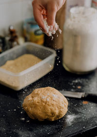 Close-up of person preparing food in kitchen