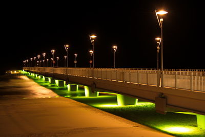 Illuminated street lights at night