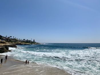 Scenic view of beach against clear sky