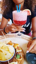 Midsection of woman holding ice cream