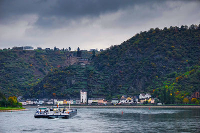 Scenic view of river against cloudy sky