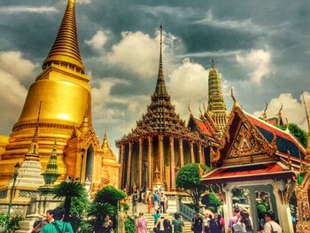 Low angle view of temple against cloudy sky