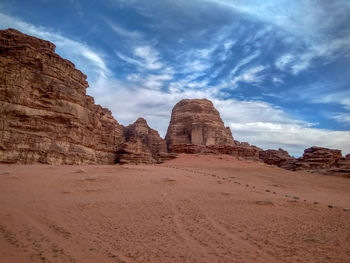 Rock formations in desert against sky