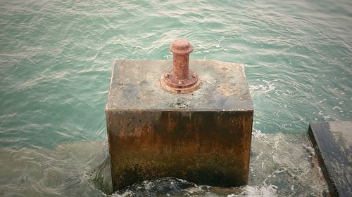 High angle view of rope on pier by sea