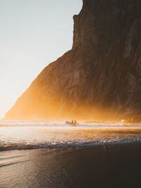 Scenic view of beach against sky during sunset