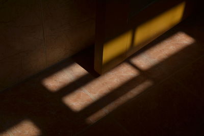 Close-up of shadow on tiled floor