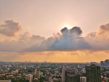 High angle view of buildings against sky during sunset