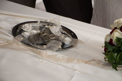 High angle view of wedding rings on table
