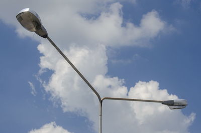 Low angle view of street light against sky