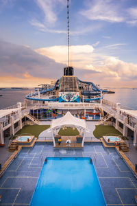 View of swimming pool against cloudy sky