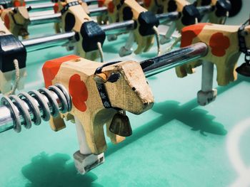 High angle view of cow figurine on foosball table