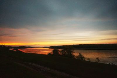 Scenic view of sunset over lake