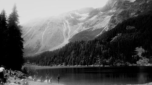 Scenic view of river with mountains in background