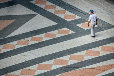 High angle view of man standing on road