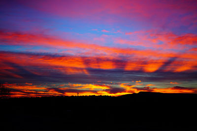 Scenic view of silhouette landscape against romantic sky at sunset