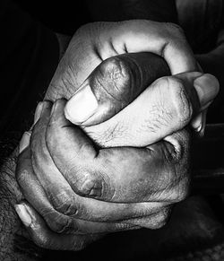 Close-up of man holding hands