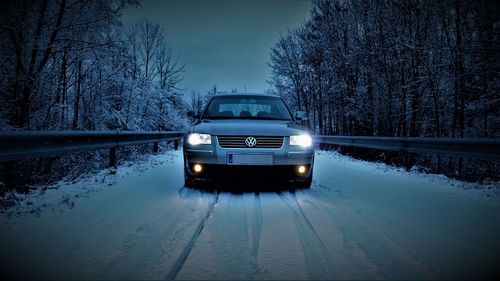 Car on snow covered road during winter